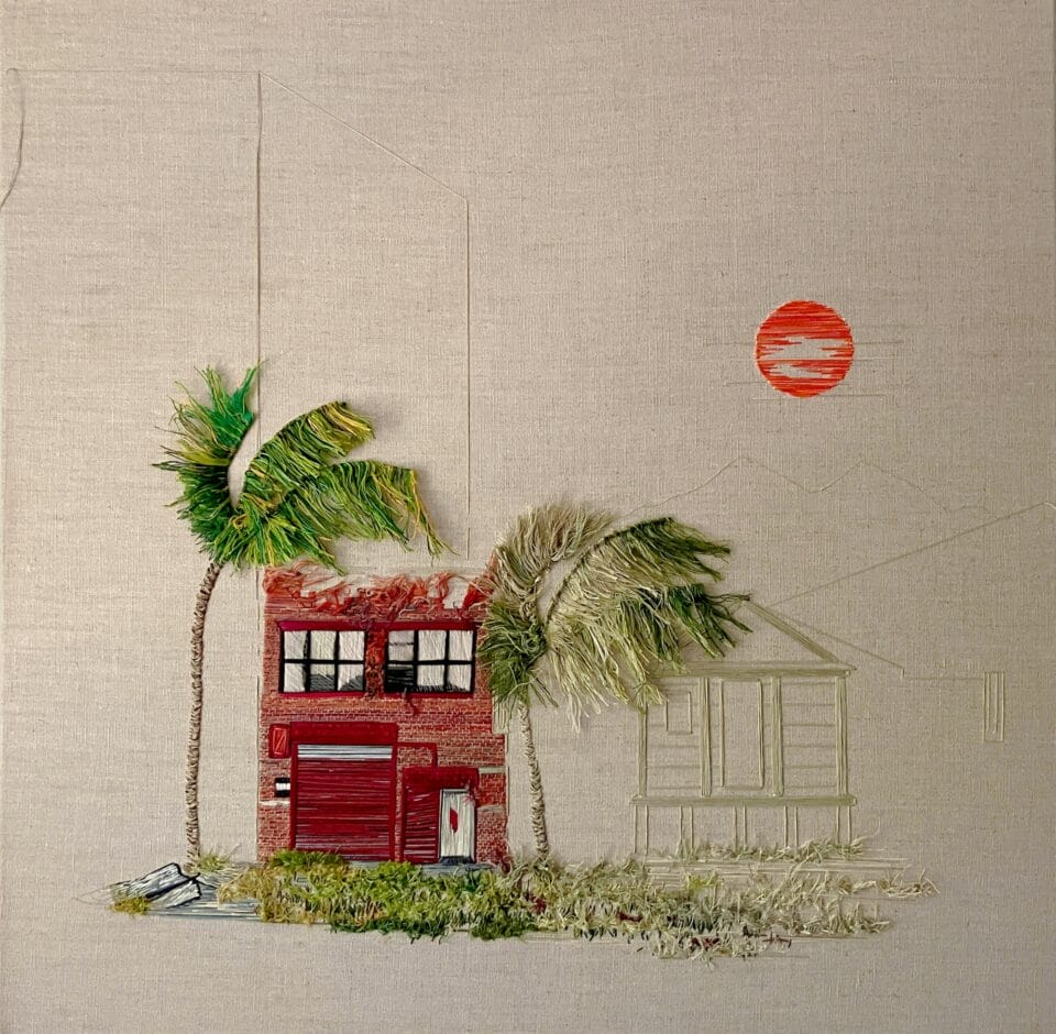 two palm trees flank a red building with tufts of a green in the foreground. a line rendering of another building stands behind with an orange sun overhead