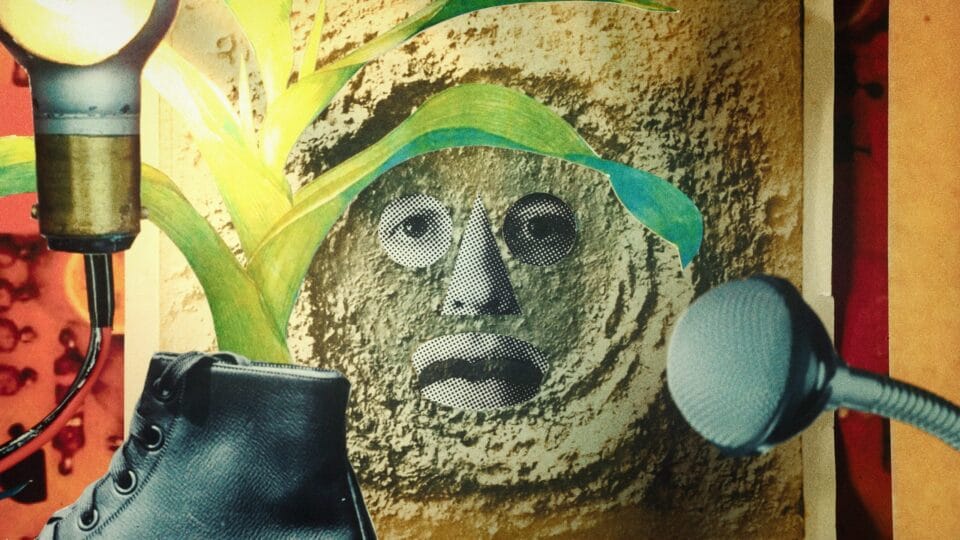 a face collaged into sand with other surreal objects
