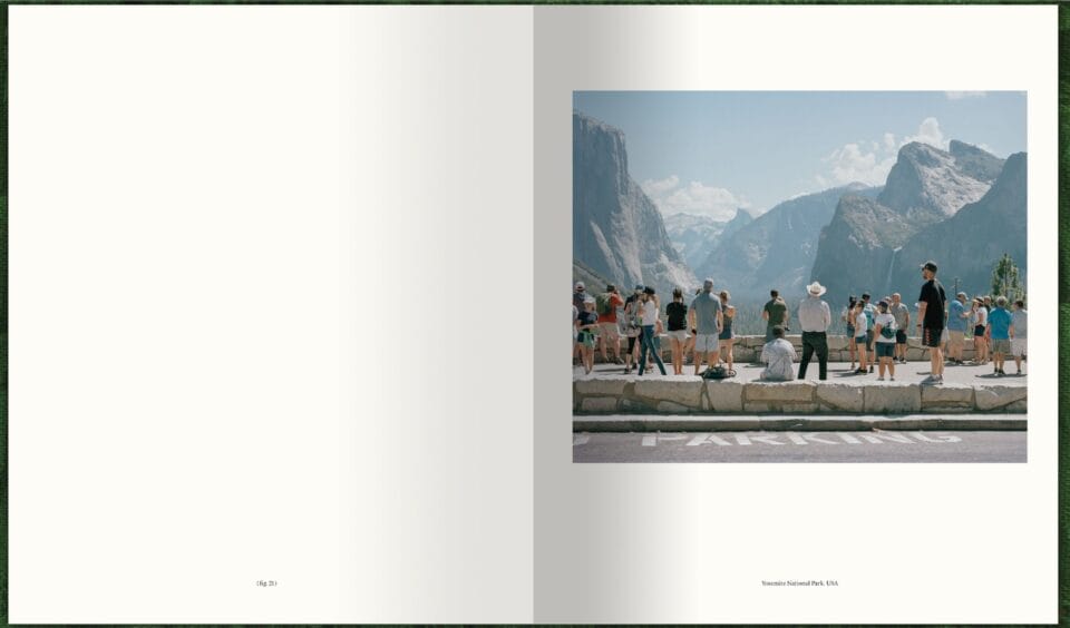 a spread of a photography book with an image on the right showing a group of tourists looking out over a mountain vista