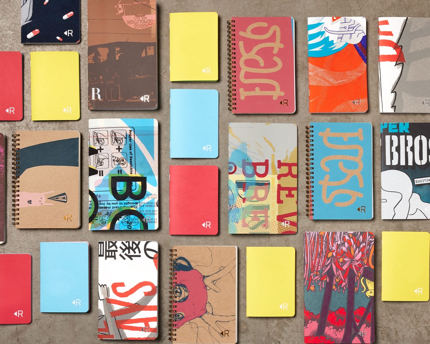 a collection of printed paper notepads