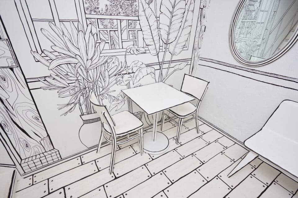a restaurant all in black-and-white with line-drawn details on every surface so that it appears like a living 2D drawing